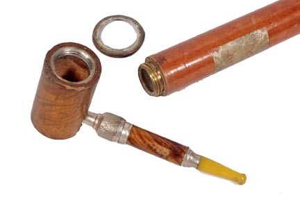 Pipe System Stick Cane-Circa 1940-A nice example o: Pipe System Stick Cane-Circa 1940-A nice example of a pipe system stick with an enameled top which has some damage, maple shaft and a metal ferrule-O.L. 34"-$100-$200