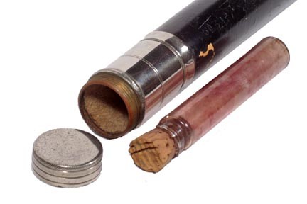 Cologne System Stick-Circa 1925-A silver metal han: Cologne System Stick-Circa 1925-A silver metal handle which opens to expose one glass vile which has a cork top, painted hardwood shaft and a metal ferrule-H. 1 ¾" x 1 ¼", O.L. 37"-$150-$250