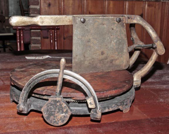 Country store cheese wheel cutter.: Country store cheese wheel cutter.