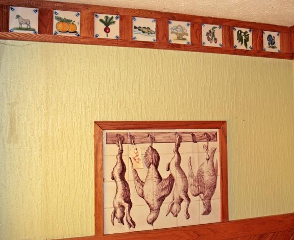 Over 100 various hand painted tiles in bakery. Av