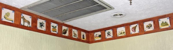 Over 100 various hand painted tiles in bakery. Av - 2