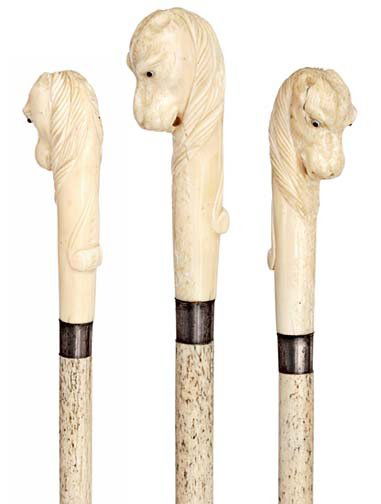Scrimshaw Walrus and Whale- Circa 1870-A nice sailo: Scrimshaw Walrus and Whale- Circa 1870-A nice sailor made cane with a figural walrus ivory handle and a whale bone shaft. Cane retains its original patina and it has an original silver collar-H. 4 ½"