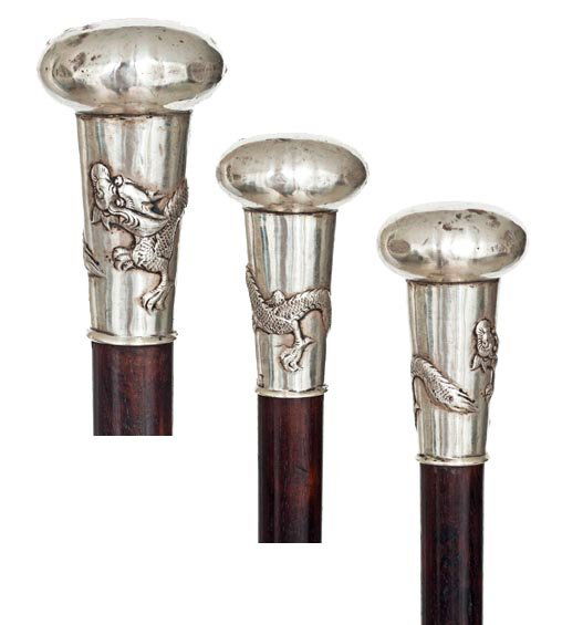 Asian Silver Dress Cane- Circa 1890-Silver knob cha: Asian Silver Dress Cane- Circa 1890-Silver knob chased with an encircling dragon. Ebony shaft and brass ferrule-H. 2 ¾" x 1 3/4", OL. 36" $400-$600