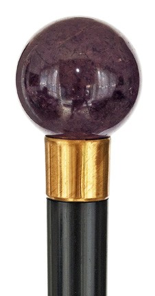 English Hard Stone Dress Cane- Late 19th Century-Ba: English Hard Stone Dress Cane- Late 19th Century-Ball handle of the dark red mineral corundum (ruby), gold colored metal collar, ebony shaft and a horn ferrule. -H. 1 ½" x 1 ½", OL. 38 ¾" $400-$700