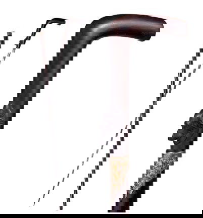 Fancy Sword Cane-Circa 1880-A gutta percha dog han: Fancy Sword Cane-Circa 1880-A gutta percha dog handle, 29" blade, ornate damascene collar, exotic wood shaft and a horn ferrule-H. 5" x 4", O.L. 37"-$800-$1,200