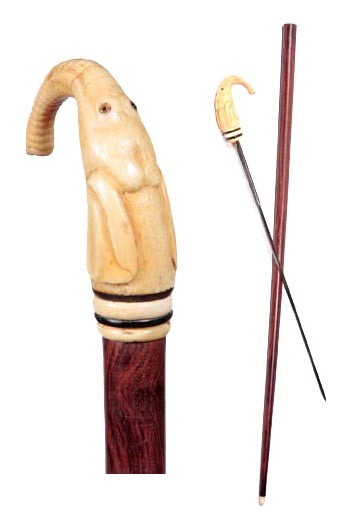 Ivory Elephant Sword Cane-Early 20th Century-Carve: Ivory Elephant Sword Cane-Early 20th Century-Carved ivory handle with two horn spacers, two color glass eyes, 18" two sided locking blade, exotic wood shaft, James Semones Collection and a bone ferrul