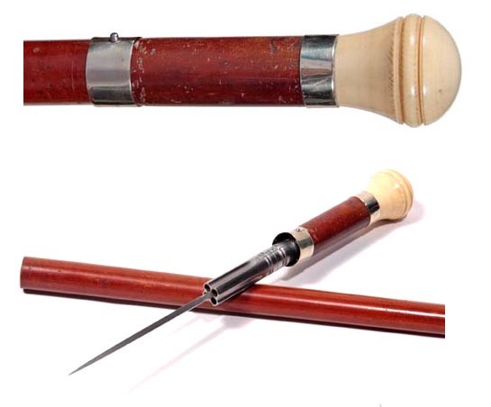 Gun and Dagger Cane-Circa 1985-A carved ivory hand: Gun and Dagger Cane-Circa 1985-A carved ivory handle, silver collar, signed "Paris", push button collar, a signed Paris shooting mechanism with a 6" pike blade which is probably about a 22 caliber, th