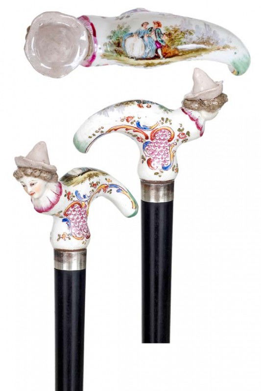 French Porcelain Cane- 19th century-Large Baroque p: French Porcelain Cane- 19th century-Large Baroque porcelain handle with girl head, finely modeled and colored painted. Ebony shaft, silver collar and a horn ferrule. Samson Signature-H. 4" x 3", O.L.
