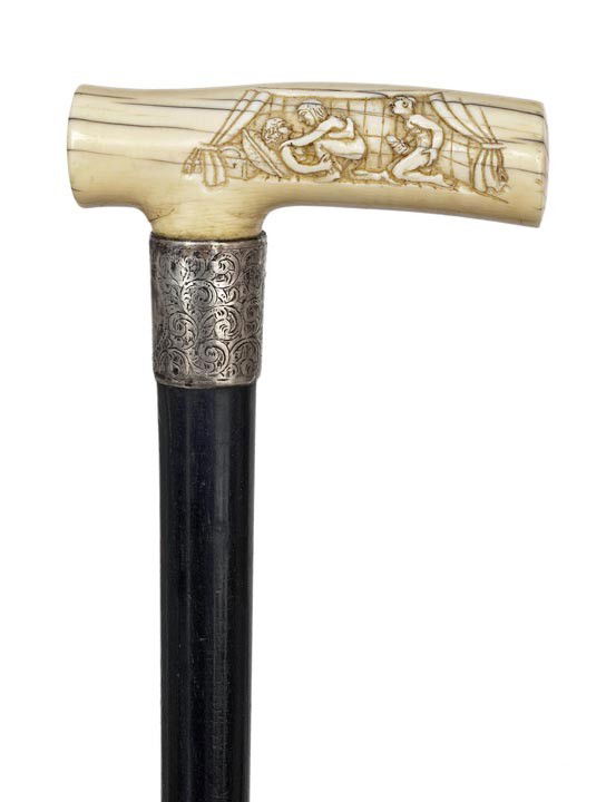 English Erotic Cane-Ca. 1870- An ivory handle on a: English Erotic Cane-Ca. 1870- An ivory handle on a deep black ebony shaft with chased silver collar and worn out bronze ferrule. The remarkably intricate and vibrant scenes are engraved with incredibl