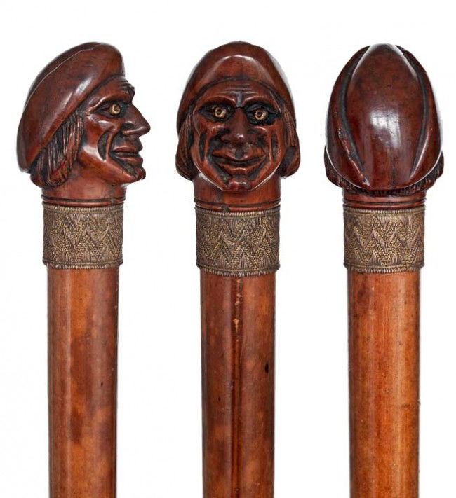 Coquilla Dutch Cane-Ca. 1790- Figural coquilla nut: Coquilla Dutch Cane-Ca. 1790- Figural coquilla nut knob carved to depict a man's head, malacca shaft with three applied metal-woven band collars and a metal ferrule. Well aged surface-H. 2" x 1 3/4",
