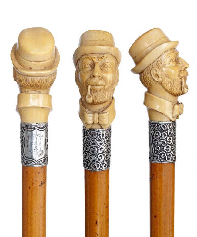 English Ivory Portrait Cane- Late 19th Century-A w: English Ivory Portrait Cane- Late 19th Century-A well carved head with bearded face, hat, bow tie and pipe, finely chased silver collar with engraved initials and hallmarks, malacca and an ivory ferru