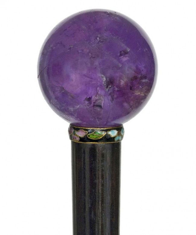 Amethyst Quartz Cane-Ca. 1890-A natural stoned bal: Amethyst Quartz Cane-Ca. 1890-A natural stoned ball handle, intense color and good transparency, ebony shaft, a cloisonné enamel collar and a horn ferrule- D-1 ¾", O.L. 38 ¼" $400-$700