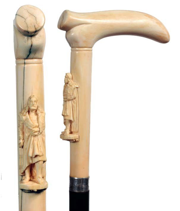 Carved Ivory Man-Ca. 1880-Large unique carving of: Carved Ivory Man-Ca. 1880-Large unique carving of a man with flowing hair in medieval attire, signed sterling collar, small section of the left foot is missing, ebony shaft and a bi-metal ferrule-H. 4