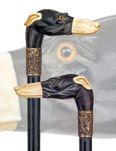 Ivory /Ebony Dog Cane-Circa 1890-A nicely carved iv: Ivory /Ebony Dog Cane-Circa 1890-A nicely carved ivory and ebony dog head with two color glass eyes, gilt collar, ebony shaft and a metal ferrule. Original condition and patina-H. 4" x 1 ¾", O.L. 35
