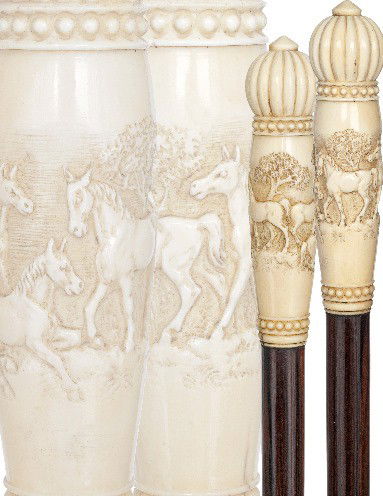 Ivory Horses Cane-English 19th Century-Vertical ivo: Ivory Horses Cane-English 19th Century-Vertical ivory handle carved with a panel showing four horses in open grassland, reeded top and beaded framing. Makassar ebony shaft and a metal ferrule.-H. 5" x