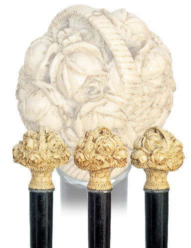 French Ivory Dress Cane-Late 19th Century-Ivory all: French Ivory Dress Cane-Late 19th Century-Ivory allegorical spring basket with flowers, jeweled silver ring collar, ebony shaft and an ivory ferrule. H. 2 ¼" x 2", O.L. 38" 1500-2500