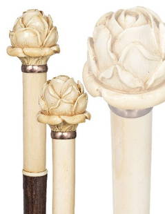 French Theater Cane -Second half of the 19th Centur: French Theater Cane -Second half of the 19th Century-An ivory handle with a rose on a cylindrical stem, rosé gold ring collar and a malacca shaft with a metal ferrule. H. 5 ¾" x 2", O.L. 37"