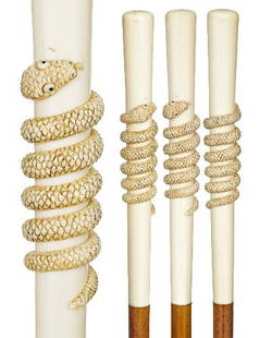 Physician Ivory Cane-England 19th Century-A tall an: Physician Ivory Cane-England 19th Century-A tall and tapering ivory handle carved with a coiled snake, malacca shaft and an ivory ferrule. High relief .-H. 8 ½" x ¾", O.L. 35 ¾" $1,200-$1,800