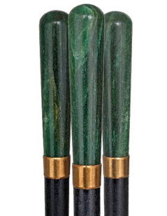 Viennese Nephrite Dress Cane Circa 1910-A Spinach g: Viennese Nephrite Dress Cane Circa 1910-A Spinach green jade in an elongated, plain and fluting shape with a round top, gilt collar, an ebony shaft and a brass ferrule-H 3 ¾" x ¾", O.L. 33