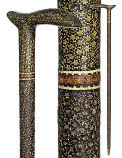 Persian Mullah Cane-Mid 19th Century-Entirely cover: Persian Mullah Cane-Mid 19th Century-Entirely covered with dense metal and ivory micro mosaics building geometrical Oriental patterns-H. 5 ¾ x 4 ¼", O.L. 34 ½" $600-$800