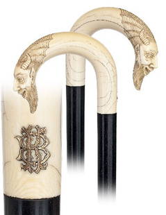 Mephistopheles Ivory Dress Cane-French 19th Century: Mephistopheles Ivory Dress Cane-French 19th Century-Ivory crook handle carved with the symptomatic horn face, applied 18 karat gold initials, ebony shaft and a ivory ferrule. Outstanding quality.-H.