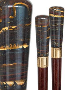 Opal Dress Cane- Circa 1910-A hardstone knob which: Opal Dress Cane- Circa 1910-A hardstone knob which seems to be a boulder opal , gilt collar, a snakewood shaft and a horn ferrule-H 3" x 1 ¼", O.L. 37" $500-$800
