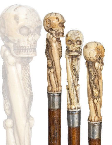 English Victorian Memento Mori -Mid-19th Century-An: English Victorian Memento Mori -Mid-19th Century-An ivory human skull on four bones and snake, hardwood shaft with metal collar and worn out ferrule-H. 4" x 1", O.L. 33 ¾" $1,200-$1,800