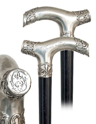 German Dress Cane-Late 19th Century-A large Opera s: German Dress Cane-Late 19th Century-A large Opera shaped .800 silver handle chased in the Revival taste, engraved initials and C. Feucht Neufs, ebony shaft and a horn ferrule. -H. 4 ½" x 2 ¾", O.L.