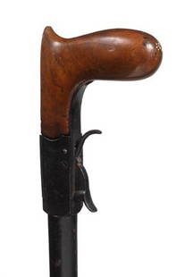 Under Hammer Gun Cane-Mid 19th Century-a nice exam: Under Hammer Gun Cane-Mid 19th Century-a nice example of this type of percussion firearm, working condition, two unreadable proof marks on the barrel and a beaded sight-H. 3" x 3 ½", O.L.