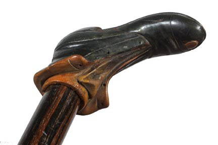 Folk Art Button Shoe Cane-Late 19th Century-A carv: Folk Art Button Shoe Cane-Late 19th Century-A carved and painted folk art shoe done with great detail, ebony shaft and a metal ferrule-H. 4" x 2", O.L. 37"-$300-$500