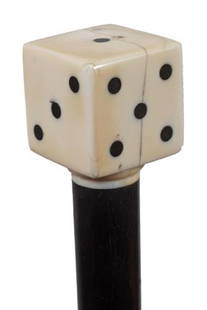 Ivory Gambler's Cane-Circa 1925-An inlaid ivory di: Ivory Gambler's Cane-Circa 1925-An inlaid ivory dice, small ivory collar, ebony shaft and a very unusual ivory bullet ferrule-H. 1 3/8" x 1 3/8", O.L. 36"-$500-$700