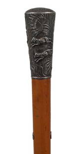 Asian Silver Dress Cane-Circa 1890-A massive silve: Asian Silver Dress Cane-Circa 1890-A massive silver handle with a high relief casting of a lion chasing lambs, small silver collar, coin silver eyelets, honey malacca shaft and a horn ferrule-H. 3" x