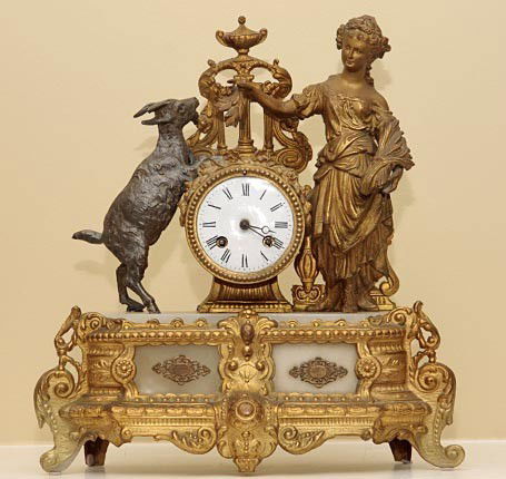 French gilt, two toned goat and lady clock, onyx ba: French gilt, two toned goat and lady clock, onyx base, works is numbered 3773, 8 day clock with bell chime, nice original and working condition. H 15" W 13" D 5"