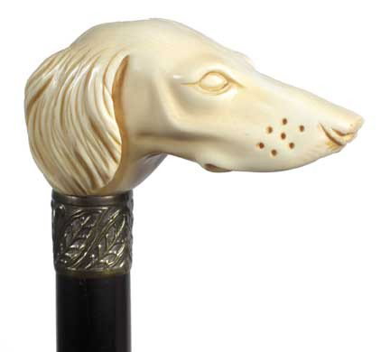 Massive Ivory Dog-Circa 1930-A large carved ivory ha: Massive Ivory Dog-Circa 1930-A large carved ivory handle, ornate brass collar, ebony shaft and a horn ferrule-H. 4" x 2" x 2 ½", O.L. 35 ½"-$1,000-$1,500