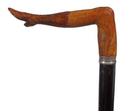Briarwood Naughty Leg Cane-Late 19th Century-A carv: Briarwood Naughty Leg Cane-Late 19th Century-A carved wood leg with a lace up boot, ornate silver collar with British Hallmarks, ebonized shaft and a 3" horn ferrule-H. 5 ½" x 2 ½", O.L. 35"-$500-$7