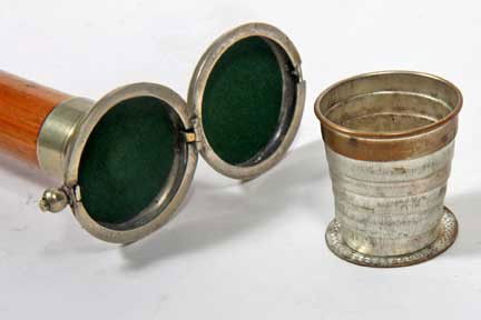 Cup System Stick Cane-Circa1880-A coin silver comp: Cup System Stick Cane-Circa1880-A coin silver compartment cane which is much like a hunting case pocket watch, but it has a fitted collapsible drinking cup, white metal collar, massive malacca shaft a