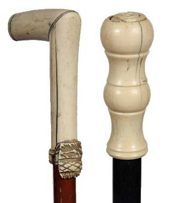 Two Ivory Canes: Early 20th Century-A pair of ivory canes one with a malacca shaft and one with an ebony shaft, both have metal ferrules and each in need of minor repairs