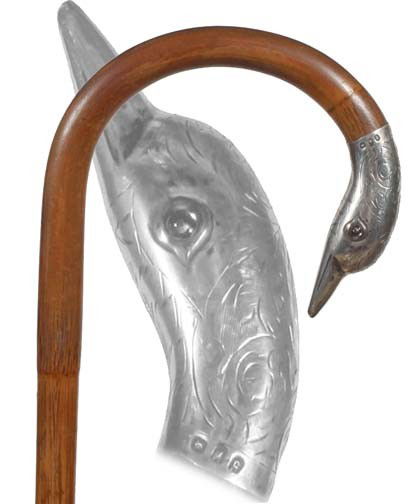 Antique cane Silver duck: 47. A British hallmarked silver swan with glass eyes, bamboo style shaft, 35 ½" O.L., brass ferrule--$350-500