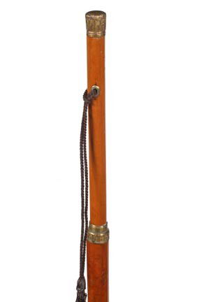 Antique cane and collectable walking stick: 156. A late 18th Century court cane with an ornate gold filled handle, pair of gold eyelets, ornate gold filled center collar, thick malacca shaft, 49" O.L., 5" brass and iron ferrule-$1,000-$1,500