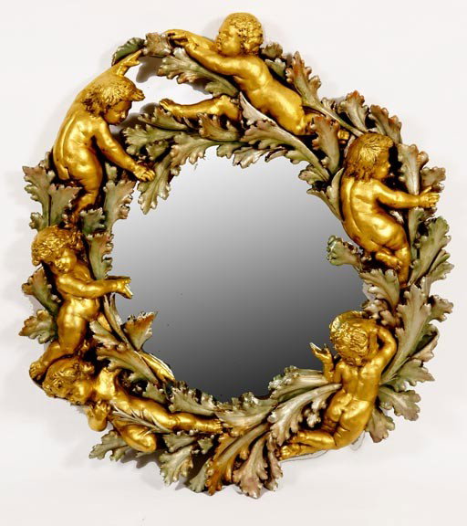 156. Restored Cherub Mirror with both Silver and G: 156. Restored Cherub Mirror with both Silver and Gold Leaf-Circa 20th century Plaster and Gesso Diameter 33"-$500-$1,000