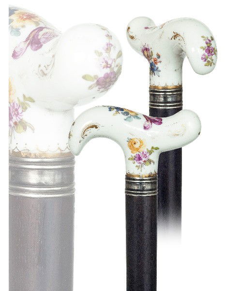 31. Meissen Porcelain Cane- 19th Century-Finest qua: 31. Meissen Porcelain Cane- 19th Century-Finest quality derby shaped white porcelain with beautiful flower sprays, ebony shaft, grooved silver collar and horn ferrule.-H. 3" x 1 ½", O.L. 37 ½"-$1,00