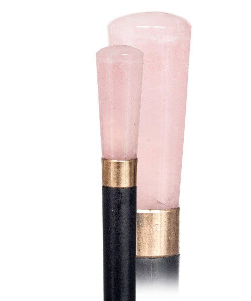 32. Rose Quartz Dress Cane-Early 20th Century- Rose: 32. Rose Quartz Dress Cane-Early 20th Century- Rose quartz handle of unusual intense color with a gilt collar and ebony shaft with a horn ferrule.-H. 2 1/2" x 1 1/4", O.L. 38 3/4"-$600-$900