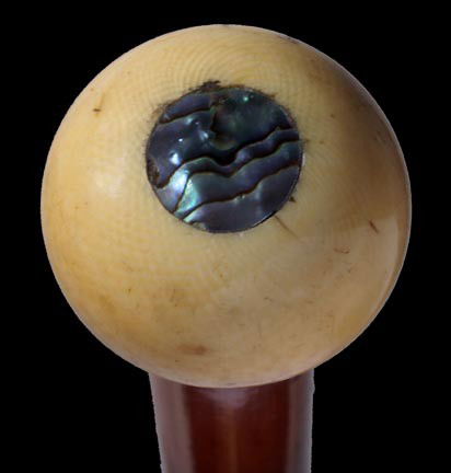 97. Early Ivory Sword Cane-Circa 1760-An ivory knob: 97. Early Ivory Sword Cane-Circa 1760-An ivory knob with an abalone disc atop, lanyard holes, gold-filled and metal collars, a signed 12" blade which has gold and bluing, malacca shaft, 4" brass and i