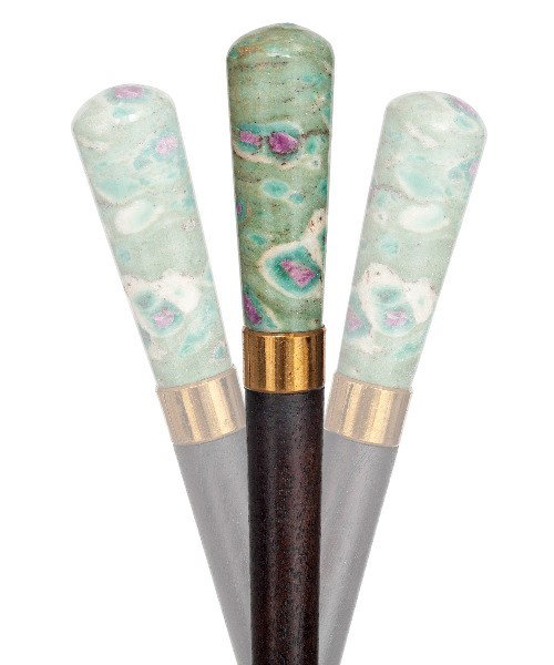 150. Hard Stone Dress Cane-Late 19th Century, poss: 150. Hard Stone Dress Cane-Late 19th Century, possibly French-Milord shaped knob of the dark red mineral corundum (ruby) in native green rock, rosewood shaft, gilt collar and a horn ferrule.-H. 2 3/4"