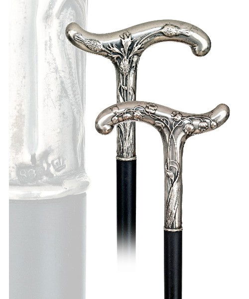 157. Art Nouveau Dress Cane-Ca. 1890- A small derb: 157. Art Nouveau Dress Cane-Ca. 1890- A small derby handle with long stems chased with lilies of the valley on one side and thistles on the other, ebony shaft with a metal ferrule. German & 800 hallma