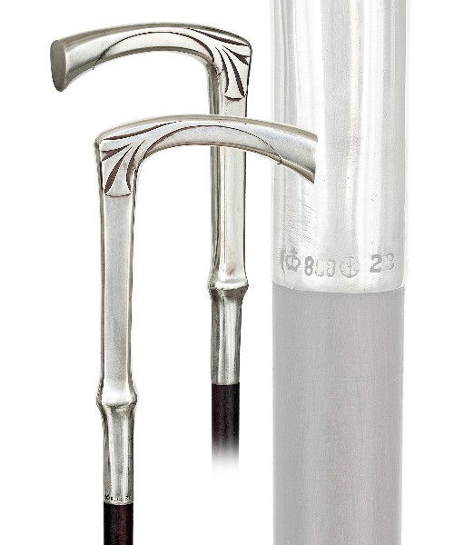 169. Art Nouveau Dress Lady Cane-Ca. 1900-Sterling: 169. Art Nouveau Dress Lady Cane-Ca. 1900-Sterling L-handle, ebony shaft and a brass ferule. German hallmarks and maker's marks-H. 5 ½"x 3", O.L. 35"-$400-$600