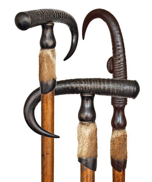 170. Alpine Hiking Cane-Early 1900s-Wild goat horn: 170. Alpine Hiking Cane-Early 1900s-Wild goat horn handle on a deer foot adjustable in a vertical position for hiking, maple shaft with a steel spike ferrule. -H 9 ¾" x 3", O.L. 38 ¾"-$400-$600