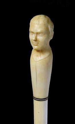 198. Full Ivory Dress Cane-Circa 1890-A carved ivo: 198. Full Ivory Dress Cane-Circa 1890-A carved ivory portrait cane of which is probably Julius Caesar, baleen and ivory shaft and a silver ferrule-H. 4 ½" x 1 ½", O.L. 35"-$800-$1200
