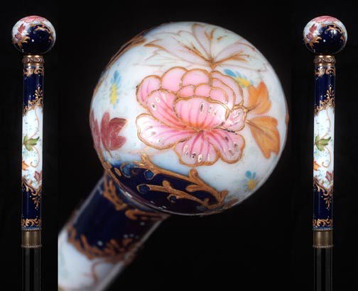 19. Porcelain Dress Cane-Circa 1890-A 1 ¼" in diame: 19. Porcelain Dress Cane-Circa 1890-A 1 ¼" in diameter porcelain ball atop a 5" porcelain shaft, two beaded brass collars, hand painted porcelain handle with detailed flower and poppy work, ebonized