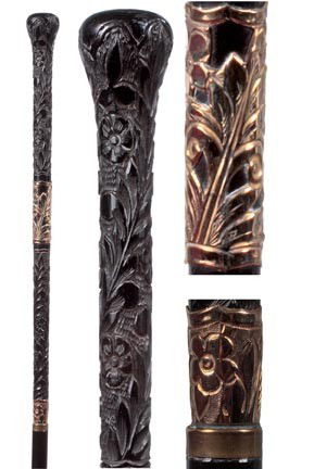 40. Ebony Dress Cane-Circa 1900-A very unique carve: 40. Ebony Dress Cane-Circa 1900-A very unique carved 15" x 1 ¼" ebony and gold filled handle, gold metal collar, ebony shaft and a horn ferrule-O.L. 36"-$400-$600